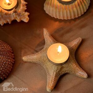 A Set of Four Shell And Starfish Shape Candle Holders