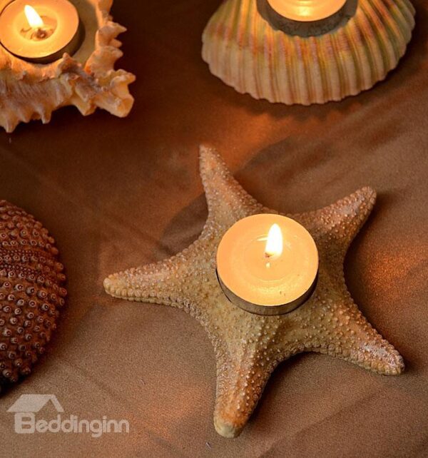 A Set of Four Shell And Starfish Shape Candle Holders